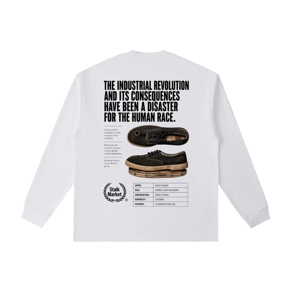 Back view of a white long-sleeve T-shirt featuring a worn industrial shoe, technical product specifications, and the headline "The Industrial Revolution and Its Consequences Have Been a Disaster for the Human Race."