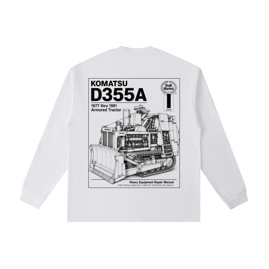 Back view of a white long-sleeve T-shirt featuring a detailed technical illustration of a Komatsu D355A bulldozer styled as a heavy equipment repair manual cover.