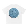 Back view of a white short-sleeve T-shirt featuring a large blue tablet designed to resemble a U.S. quarter with George Washington, the words "THE GOD WE LUST," and "1981."