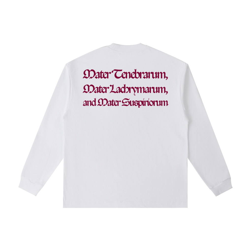 Back view of a white long-sleeve T-shirt featuring the Latin phrase "Mater Tenebrarum, Mater Lachrymarum, and Mater Suspiriorum" printed in dark red Gothic lettering.